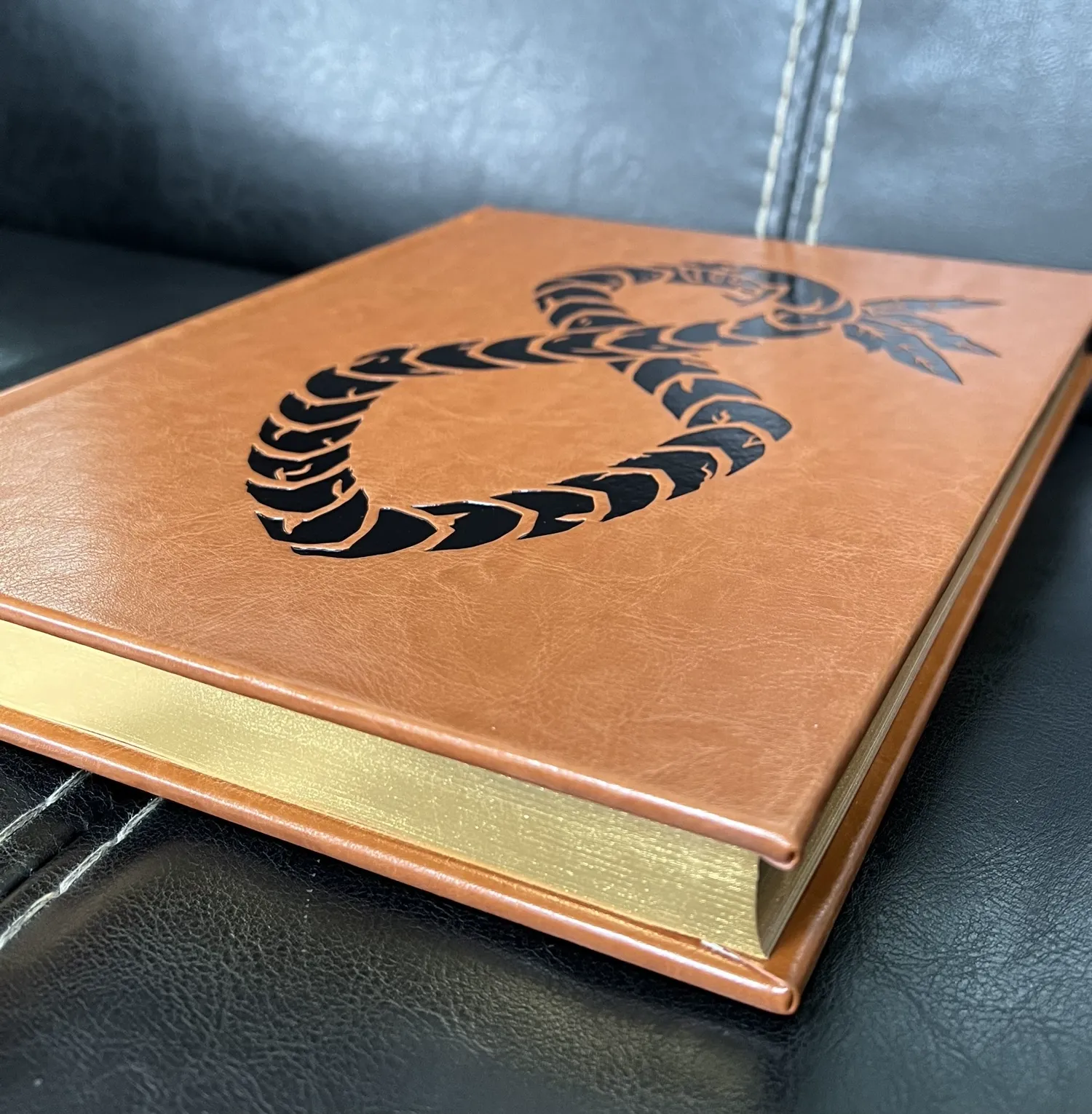 Hardcover book
Cover wrapped with imitation paper
Deboss and spot UV on cover
Gilding on book edges